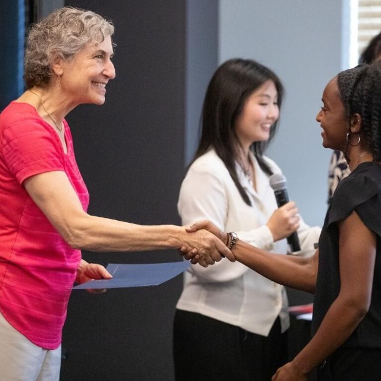 UCR Provost Elizabeth Watkins shakes hands