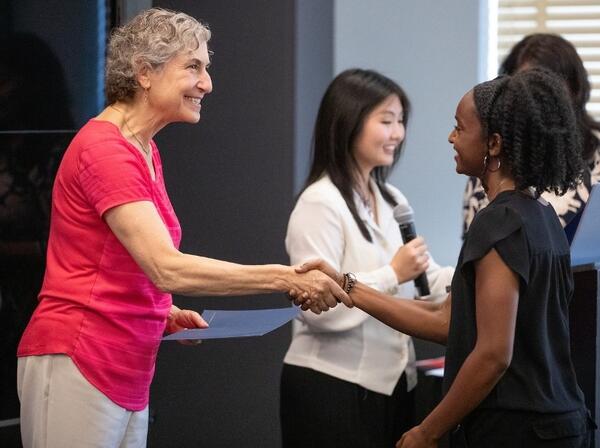 UCR Provost Elizabeth Watkins shakes hands
